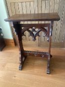 A gothic style side table, 85cm high, 34cm wide.