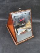 A delightful early 20th centuey travel mirror in crocodile leather case.