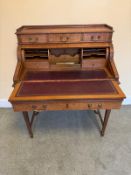 A fine quality Edwardian cylinder bureau having three drawers over captive rotating cylinder.