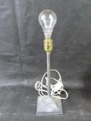 A chrome table lamp. Disclaimer: electrical items are sold as untested and without guarantee.