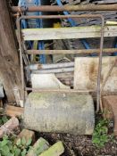 A vintage lawn roller.