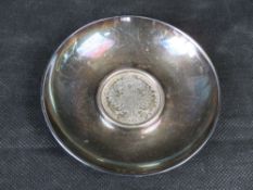 An 800 grade silver dish having central inset 1780 Maria Theresa Thaler silver trade coin, 96.