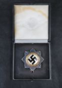 A German Cross in 'gold' in presentation box.
