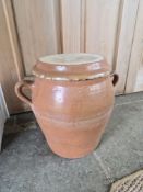 A large salt glazed pot with lid.