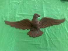 A cast iron eagle stamped verso 7305 with star and 24