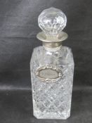 A decanter having white metal collar and Whisky label.