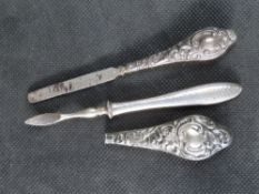 A manicure tool with hallmarked silver handle,