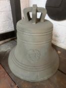 A cast bell with cast in crown staples removed, top drilled, clapper deficient,