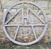 A late 19th / early 20th century oak bell wheel having champheres spoke decoration throughout,