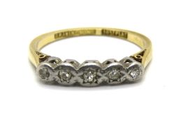 A vintage 18ct gold and diamond ring, the five diamonds in platinum illusion settings,