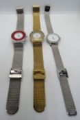 Three Christin Lars wristwatches on integral straps.