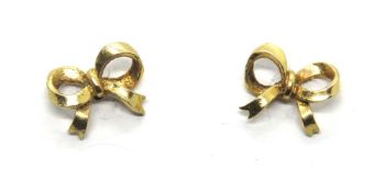 A pair of 9ct gold stud earrings in the form of bows, hallmarked 375, 1g.