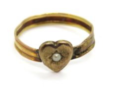 A vintage 9ct gold ring having seed pearl to central heart shaped shield, stamped 9ct, naive repair,