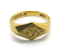 An 18ct gold signet ring 'MF', having Chester hallmark for 1868-9, size K, 3.7g.