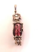 A 925 silver and glass bead pendant in the form of a doll.