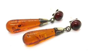 A pair of amber drop earrings.