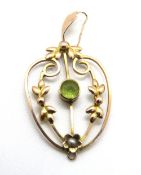 A late 19th early 20th century 9ct gold peridot and seed pearl pendant, slight a/f, stamped 9ct, 1.