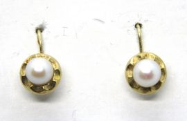 A pair of 14ct gold and pearl earrings, stamped 585, 1.