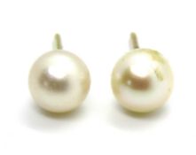 A pair of 9ct gold and pearl earrings, stamped 9ct to the stud.