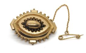 An antique pinchbeck brooch, having safety chain, 6.