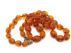 An amber bead necklace having 925 silver clasp.