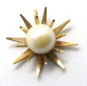 A yellow metal sunburst pendant having central white pearl, approx 2cm dia, 2.2g.