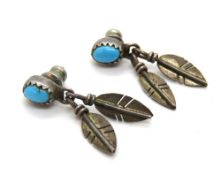 A pair of Native American style turquoise earrings.