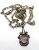 A handmade pendant stamped 925 on substantial silver chain.