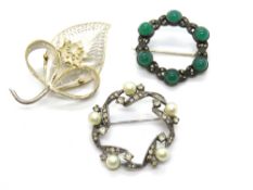 A 925 silver filigree brooch, together with two silver wreath brooches. Three items.