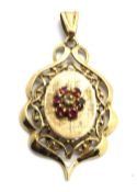 A yellow metal pendant having central ruby floral cluster, indistinct stamp, approx 4.