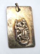 A hallmarked silver St Christopher pendant.