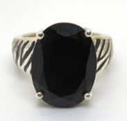 A silver and black onyx ring having enamel tiger stripes to the band, size K/L.