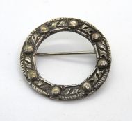A silver Celtic style wreath brooch hallmarked for Chester.