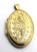 A substantial 9ct gold locket of oval form, hallmarked 375, approx 4cm inc bale, total weight 8.