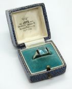 An Art Deco 18ct white gold aquamarine and iolite ring in typical stepped style,