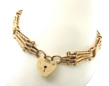 A 9ct gold gate link bracelet with heart padlock clasp, hallmarked 375, 11.1g.