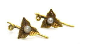A pair of yellow metal and seed pearl ivy leaf earrings, no apparent hallmarks, 0.6g.