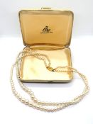 Ciro; A double strand of Ciro faux pearls on 9ct gold clasp, stamped 9ct Ciro, within original box.