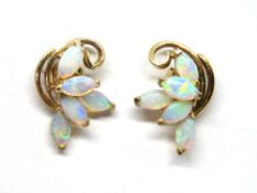 A pair of opal stud earrings, foliate form with cluster of five marquise shaped opals to each stud,