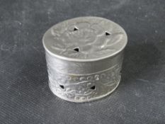 A white metal pot in floral design, 38.7g.