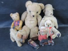 A collection of vintage teddies and toys including stuffed and jointed mohair example.
