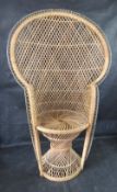 A small sized wicker or cane Peacock chair, for teddy or doll display.