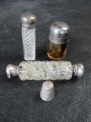 Two hallmarked silver and cut glass perfume or smelling salts bottles together with a silver