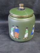 Attributed to George Tinworth; a green tobacco jar having GT painted motif to base,