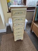A handpainted chest of drawers.