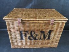 A large F&M wicker hamper.