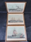 A set of three nautical prints in matching frames.