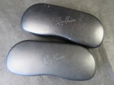 Two Rayban glasses cases.