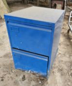 A two drawer filing cabinet.