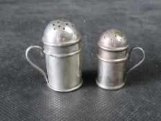 Two hallmarked silver miniature flour sifter novelty pepper pots, 17.5g.